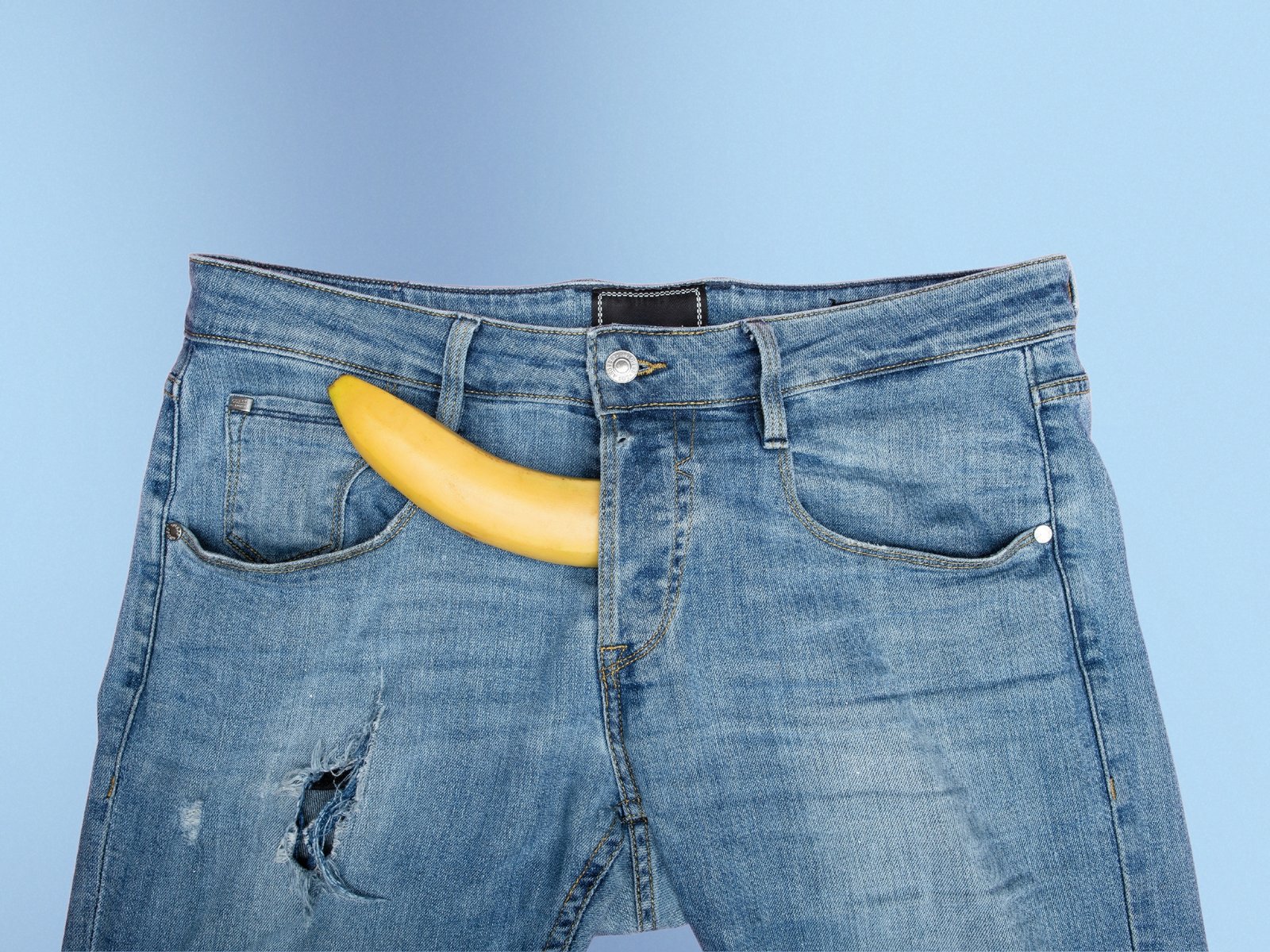 Blue trousers with a banana symbolizing a penis